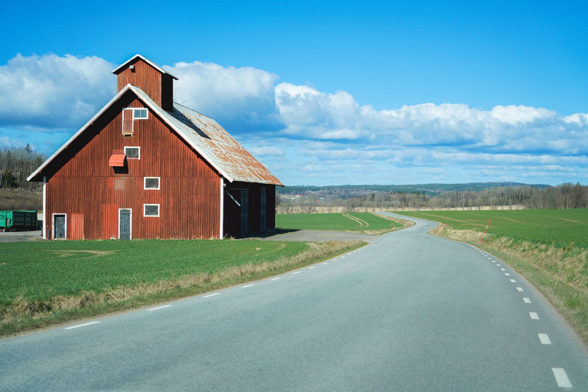 A red barn on a country road near Salisbury, NB where we do junk removal